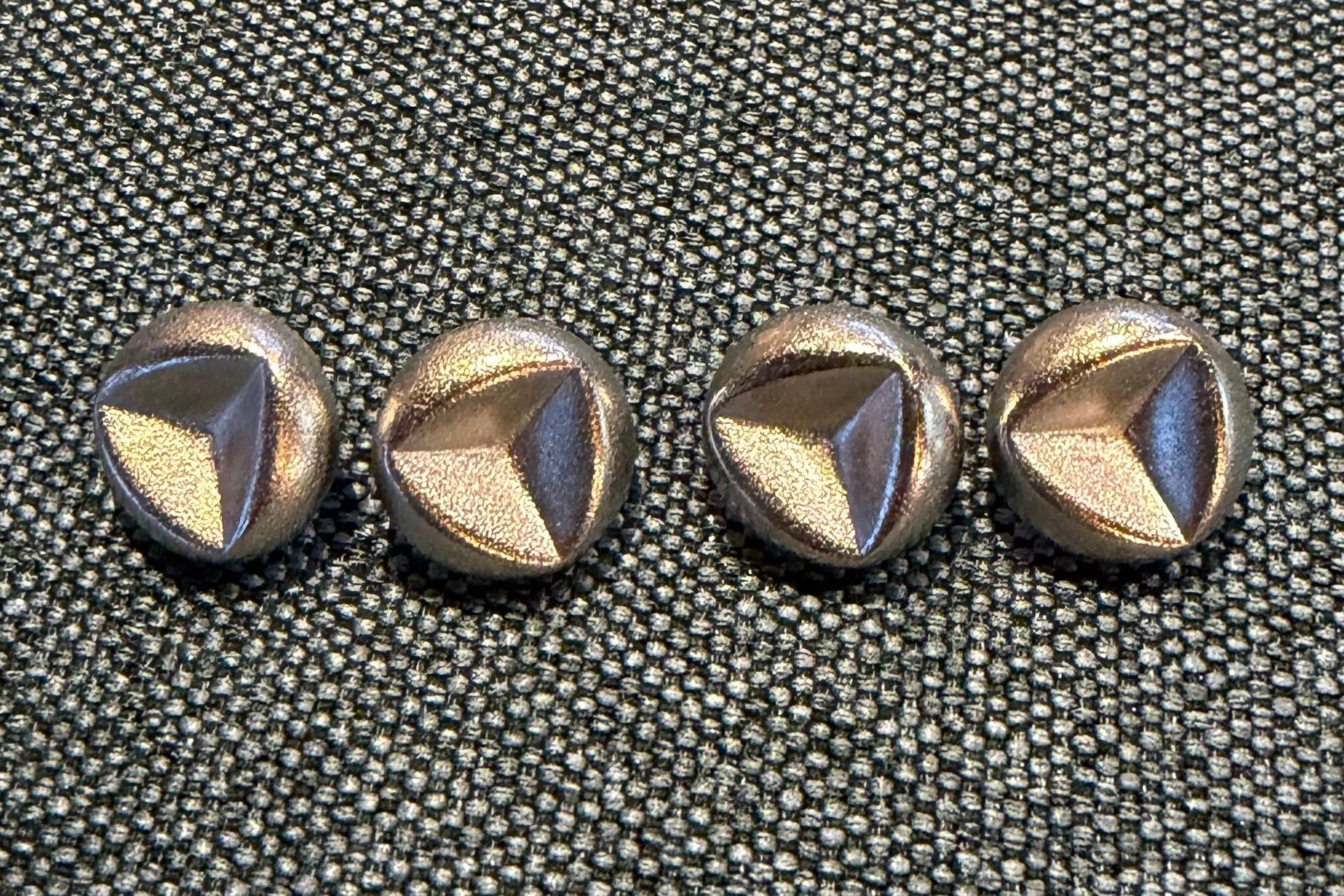 Set of decorative buttons on a textured surface