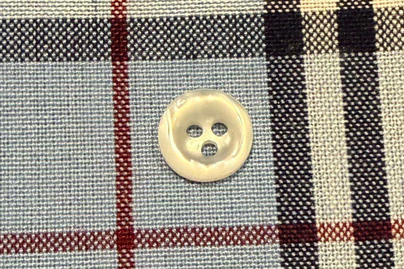 Plaid fabric with a button in the center